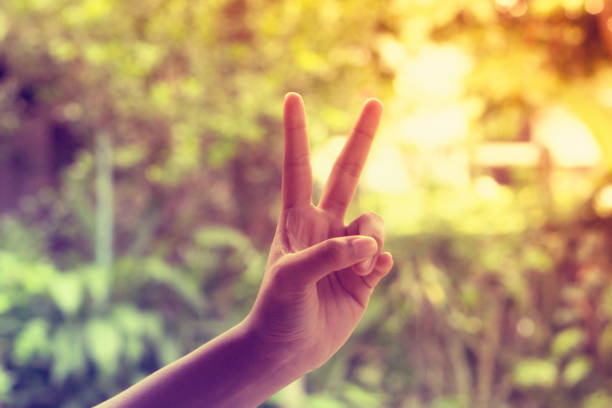 istock Sign of victory ,Two fingers raised up 824809630