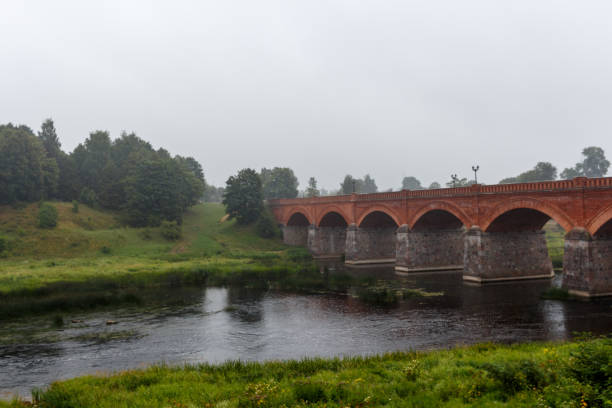 istock Brick bridge across Venta in Kuldiga, Latvia 824809800
