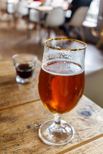 istock glass with beer on a table in the restaurant 824809916