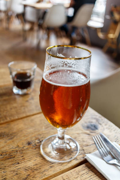 istock glass with beer on a table in the restaurant 824809920