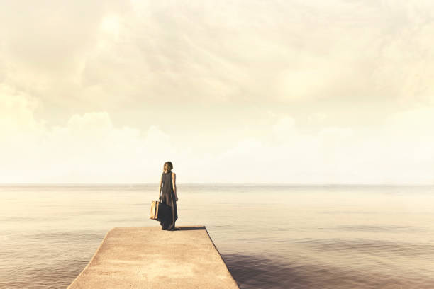 istock Woman with suitcase walking to an unknown destination looking for herself 824815398