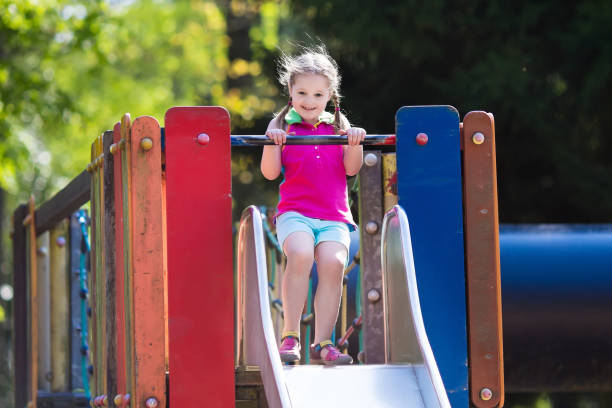 istock Child playing on outdoor playground in summer 824815724