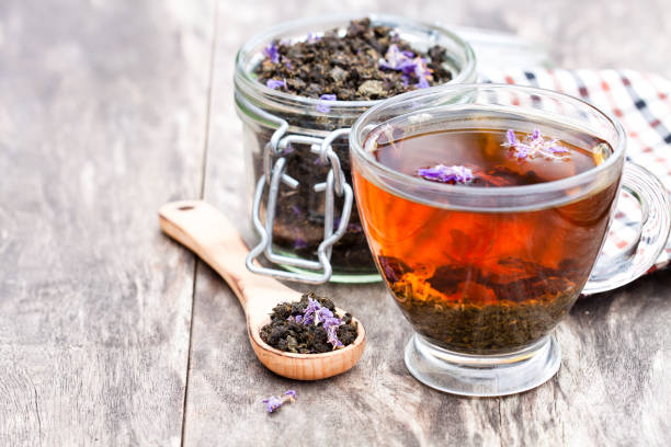 istock cup  of tea with willow-herb on wooden background 824815870