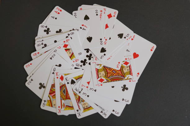 istock Deck of playing card spread out on a table 824816806