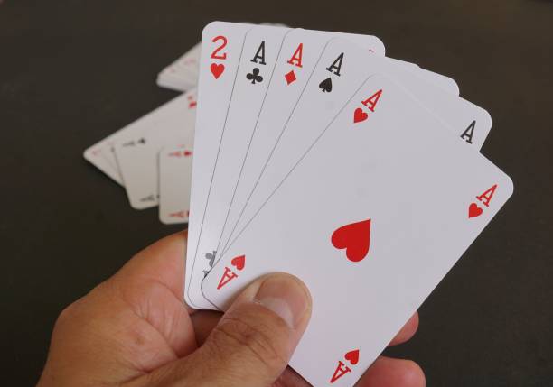 istock Aces poker cards in hand 824817046
