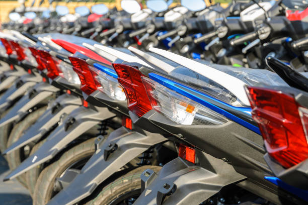 istock New motorcycles parked in a row on the sidewalk 824821118