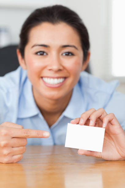 istock Charming woman showing her visiting card 824832116