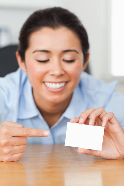 istock Pretty woman showing her visiting card 824832136