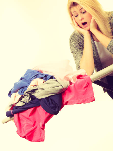 istock Woman holding iron about to do ironing 824832278
