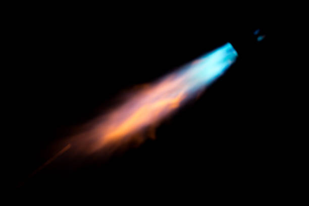 gas flame over black sky background - flame gas natural gas blue imagens e fotografias de stock