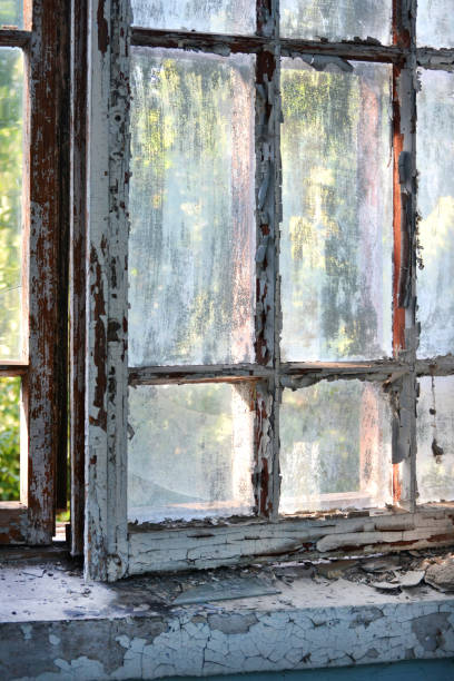 istock Old window with shabby cracked paint 824852038