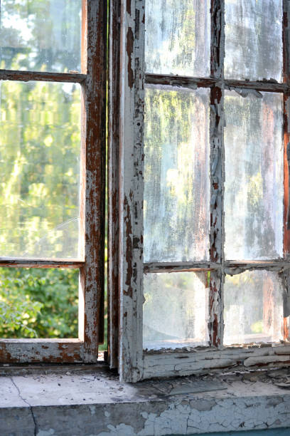 istock Old window with shabby cracked paint 824852108