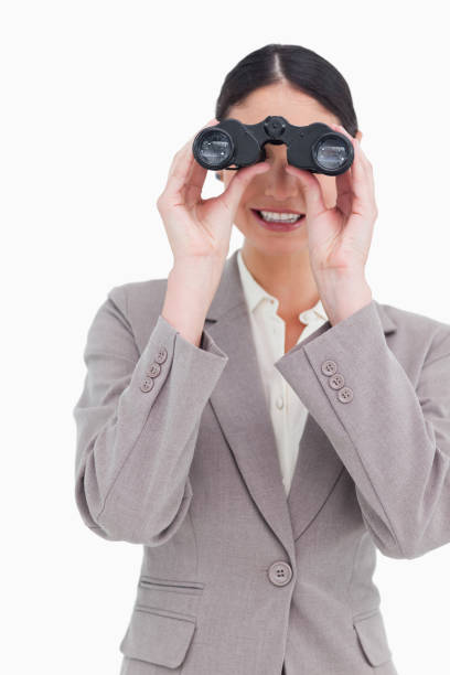 istock Businesswoman looking through binoculars 824852452