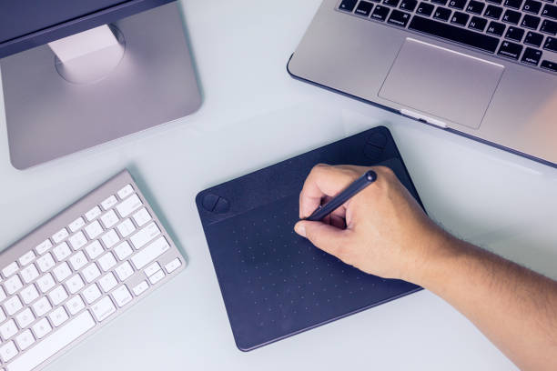 istock Close up hands male working on graphic tablet 824856312