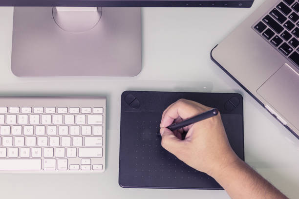 istock Close up hands male working on graphic tablet 824856346