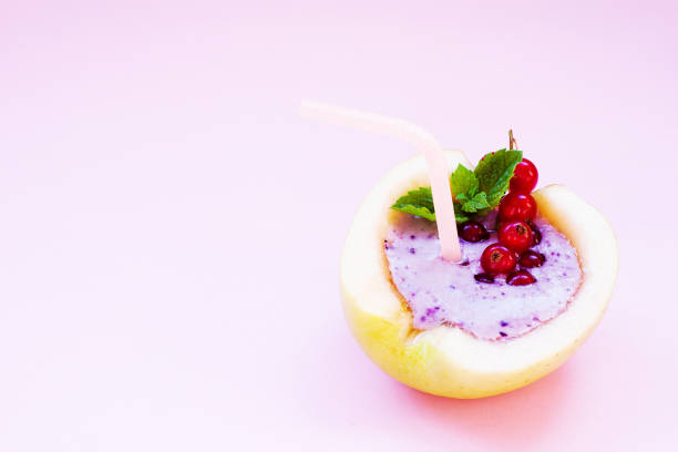 smoothie in apple with blueberry, banana, mint, red currant and milk on pink background. flat lay. minimal and modern summer concept. - blueberry smoothie milk shake drink imagens e fotografias de stock