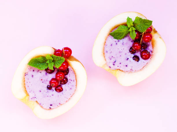 smoothie in apple with blueberry, banana, mint, red currant and milk on pink background. flat lay. minimal and modern summer concept. - blueberry smoothie milk shake drink imagens e fotografias de stock