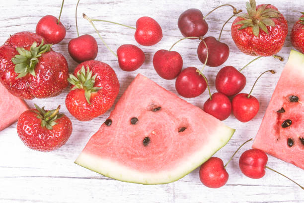 istock Watermelon, strawberries and cherries on wooden background. 824860606