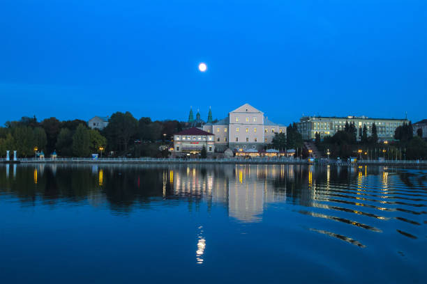 istock swimming boat at fool moon 824863372
