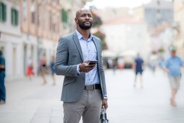 istock Businessman looking navigation on smart phone 824863860