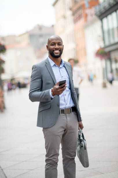 istock Businessman looking navigation on smart phone 824863880