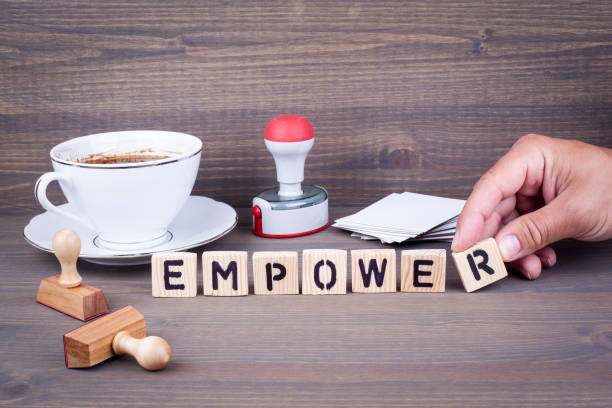 istock empower. Wooden letters on dark background 824863942