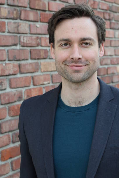 istock Natural good looking young businessman smiling 824864066
