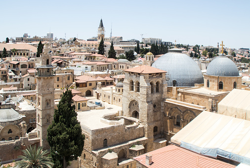 View of the  Minaret of the Mosque Omar and Church of the Holy Sepulchre from the Corner tower of the Evangelical Lutheran Church of the Redeemer in the old city of Jerusalem, Israel.