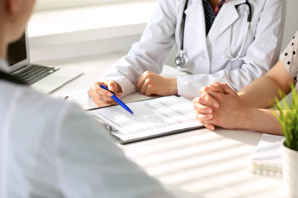 istock Doctor and patient are discussing something, just hands at the table 824864924