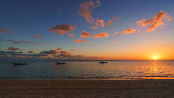 istock Fishing boat at sunset time 824865072