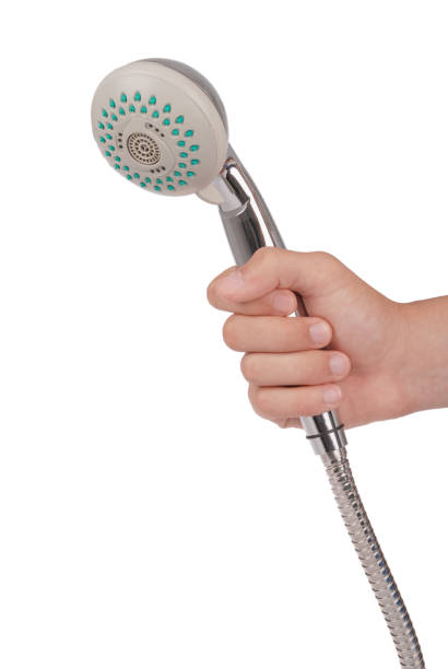 Chrome metallic shower New chrome metallic shower head with water spray adjustable which keeps the arm isolated on white background rustproof stock pictures, royalty-free photos & images