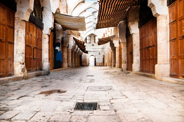 traditional souks street with roof in tripoli, lebanon - tripoli imagens e fotografias de stock