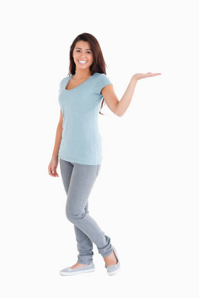 istock Pretty woman showing a copy space while standing 824865544
