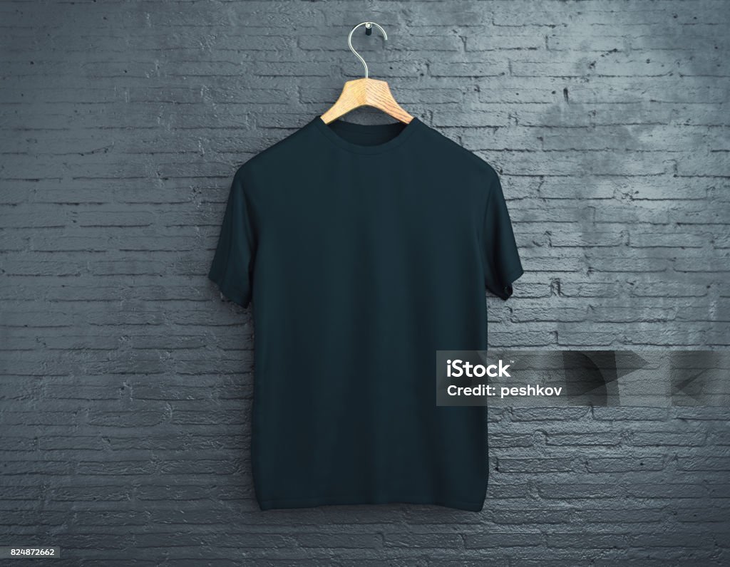 Black t-shirt on brick background Wooden hanger with empty black t-shirt hanging on dark brick background. Retail concept. Mock up. 3D Rendering T-Shirt Stock Photo
