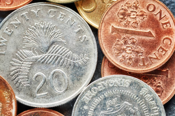 Close up picture of Singapore dollar coins. Close up picture of Singapore dollar coins, shallow depth of field. singapore cash stock pictures, royalty-free photos & images
