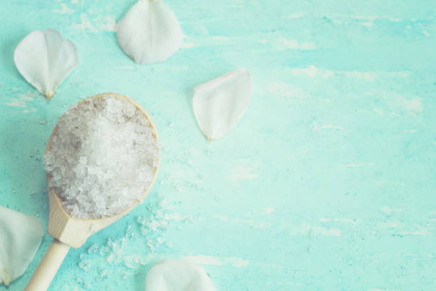 istock beautiful Spa background with sea salt and rose petals 824878308