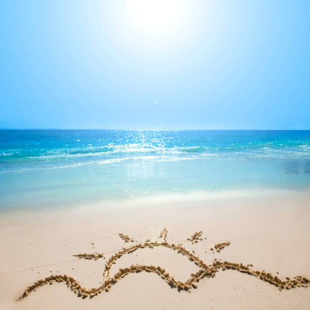 istock Drawing of sun on beach sand 824879160