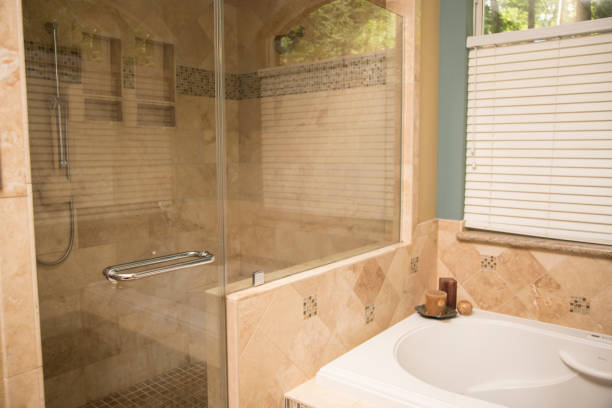 istock Upscale home master bathroom bathtub and shower space. 824880010