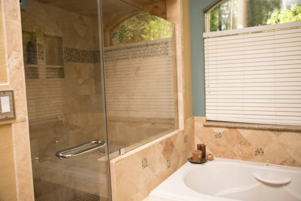 istock Upscale home master bathroom bathtub and shower space. 824880572