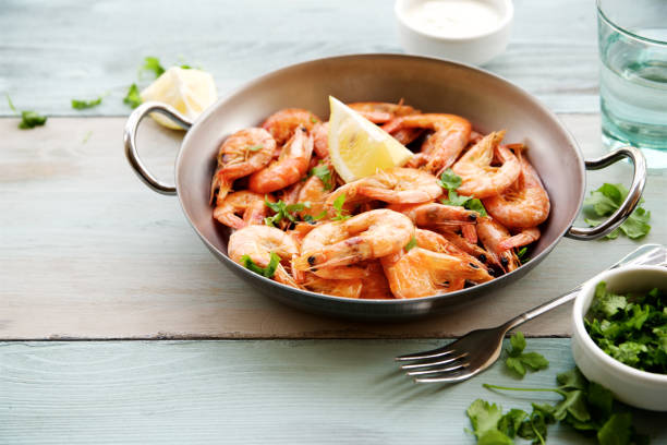 istock Fried prawns served with garlic sauce and parsley. 824886198