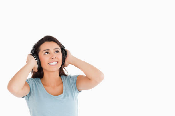 istock Attractive woman with headphones looking at something 824887164