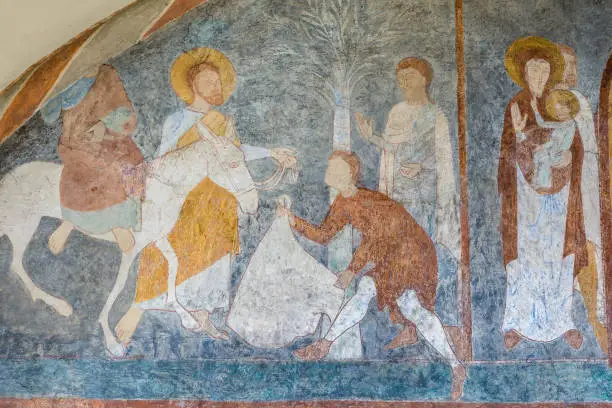 The entry into Jerusalem, a medieval fresco painting in blue, Jorlunde church, Denmark, July 24, 2017