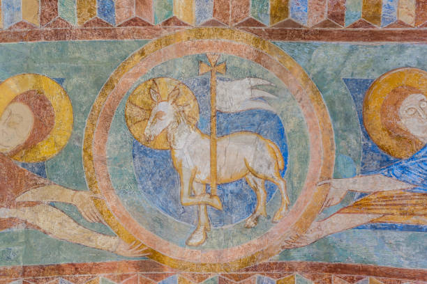 Lamb of God, a medieval fresco painting Lamb of God, a medieval fresco painting in blue, Jorlunde church, Denmark, July 24, 2017 agnus dei stock pictures, royalty-free photos & images