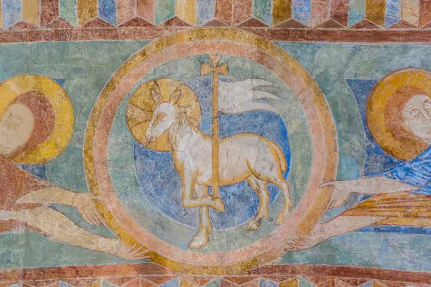 Lamb of God, a medieval fresco painting in blue, Jorlunde church, Denmark, July 24, 2017