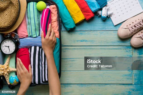 Woman Packing A Luggage For A New Journey And Travel For A Long Weekend Stock Photo - Download Image Now