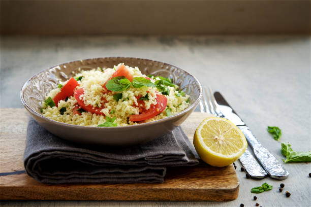 istock Couscous with parsley, tomato, lemon and olive oi 824893484
