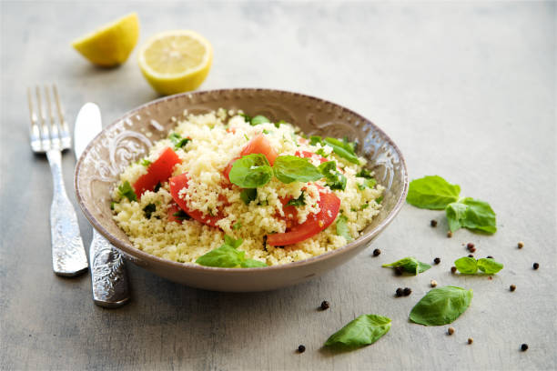 istock Couscous with parsley, tomato, lemon and olive oi 824893486