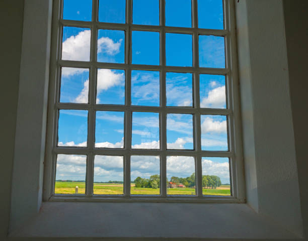 istock Window of an ancient church in sunlight 824896112