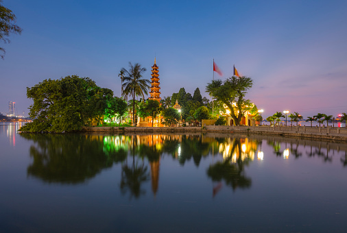 The Tran Quoc Pagoda in Hanoi is the oldest pagoda in the city, originally constructed in the sixth century during the reign of Emperor Lý Nam Đế (from 544 until 548), thus giving it an age of more than 1,450 years. When founded the temple was named Khai Quoc (National Founding) and was sited on the shores of the Red River, outside of the Yen Phu Dyke. When confronted with the river's encroachment, the temple was relocated in 1615 to Kim Ngu (Golden Fish) islet of Ho Tay (West Lake) where it is now situated. A small causeway links it to the mainland.