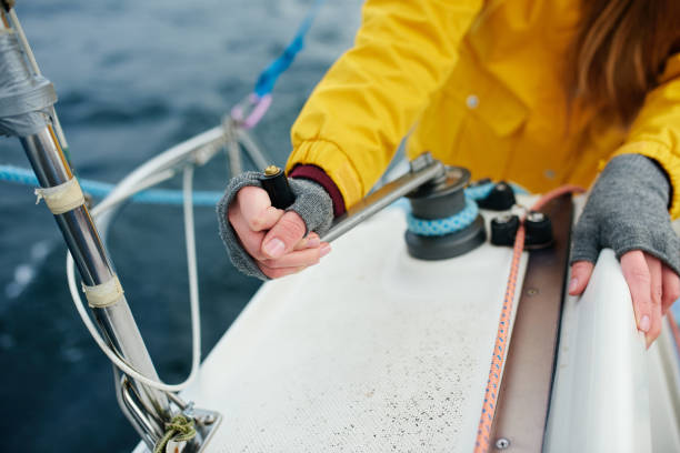 istock Young strong woman sailing the boat 824903180